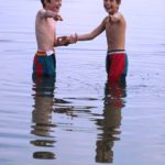 Having fun 2: Two boys amusing the photographer