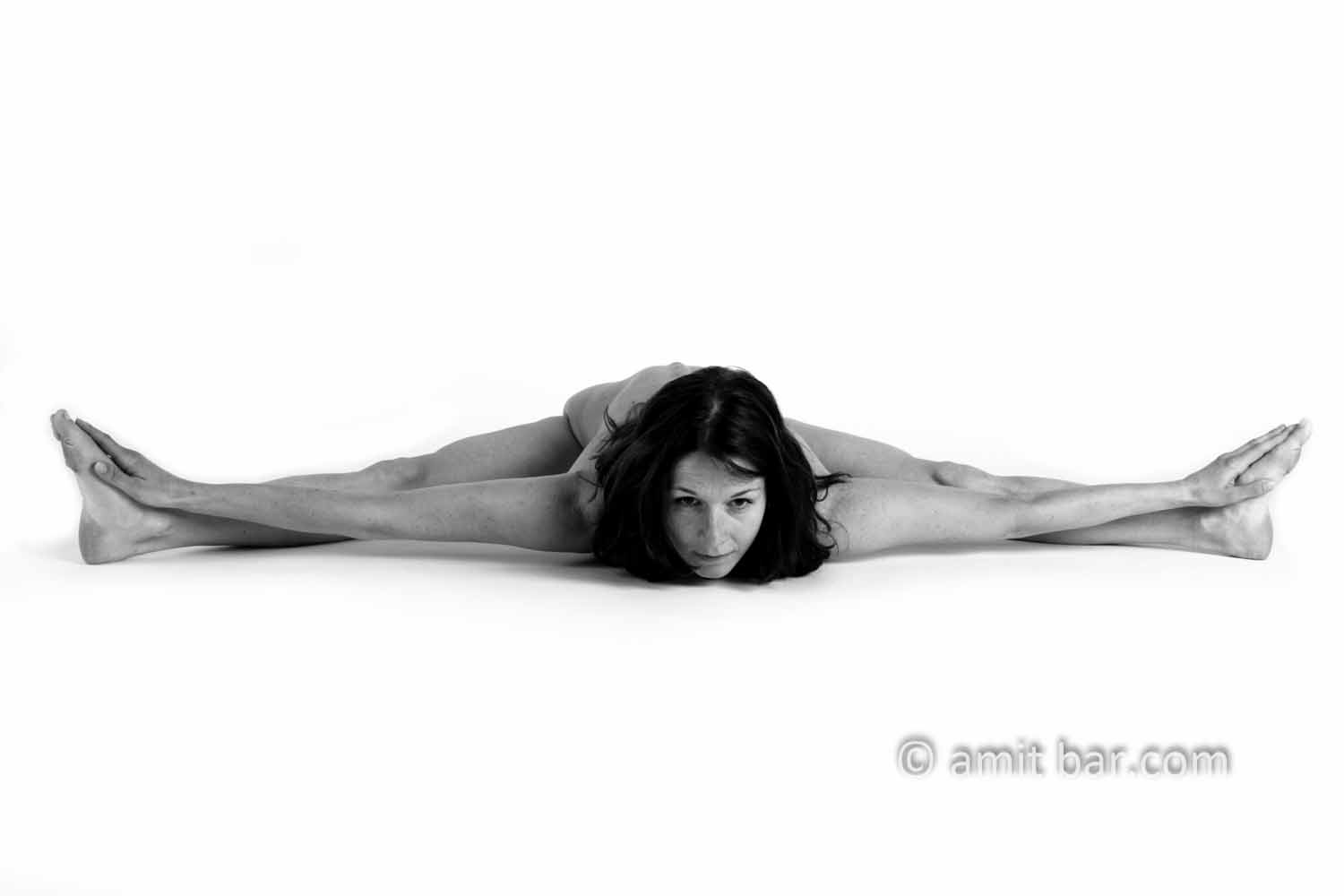 Horizontal yoga III: A nude model executing yoga-exercise