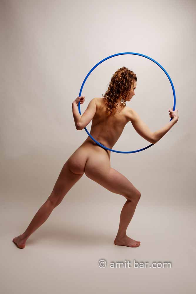 Hula hup: A nude model with Hula Hup in her hands