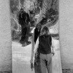 Is it me?: A girl in front of curved plate