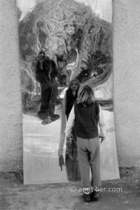 Is it me?: A girl in front of curved plate