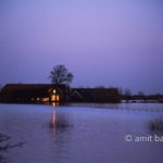 Last sun: Last sun stray on flooded farmhouse by Doesburg, The Netherlands