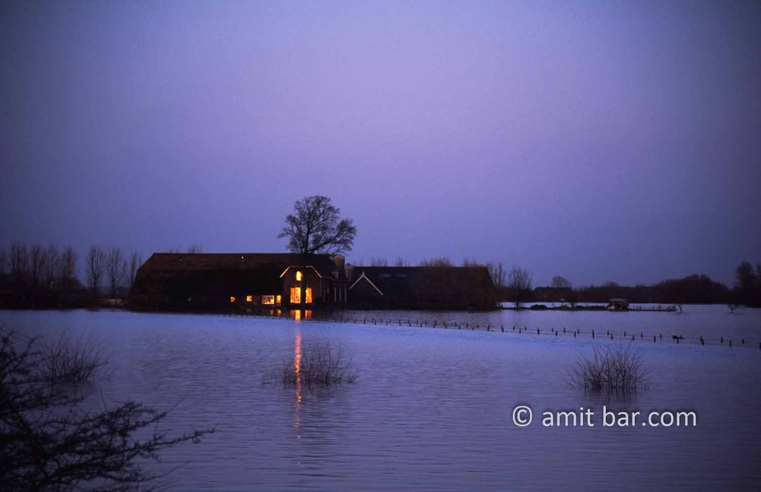 Last sun: Last sun stray on flooded farmhouse by Doesburg, The Netherlands