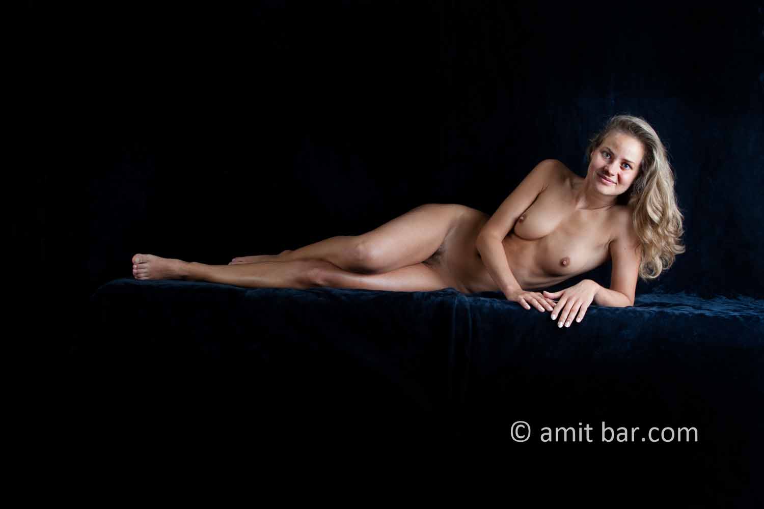 Leaning on elbow: Nude model leaning on elbow