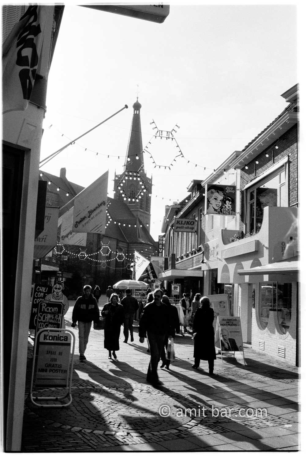 Lights and shadows: A group of people is walking on street in Doetinchem, The Netherlands