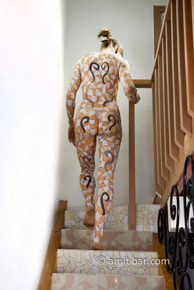 Mosaic girl I: Body-painted model on mosaic staircase