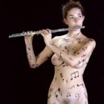 Music notes II: Body-painted model playing flute