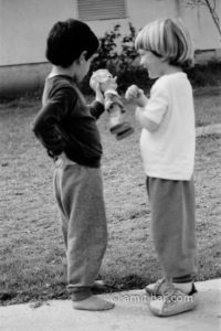 My puppet: A boy is showing his puppet to his friend