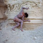 Nachal Prazim III: Body painted model at the desert of the Dead Sea, Israel.