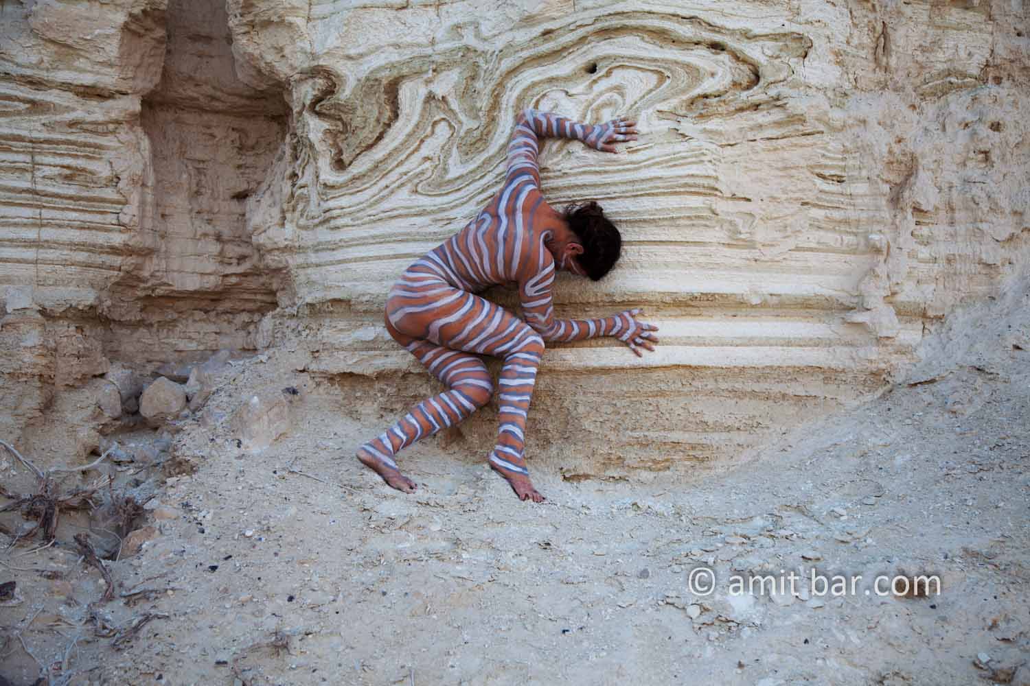 Nachal Prazim III: Body painted model at the desert of the Dead Sea, Israel. 