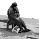 New shoes: A woman is sitting with her feet above her new shoes