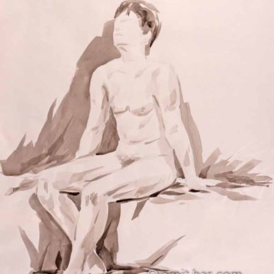 Nude man sits on a box