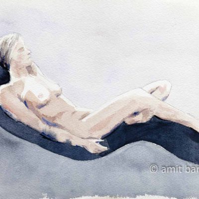 Nude model laying on a relaxing chair