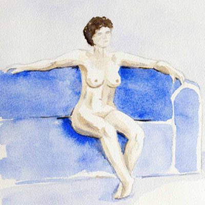 Nude model sitting on a sofa with arms aside