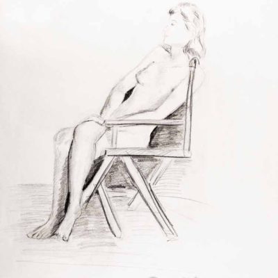 Nude woman on wooden chair