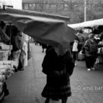 Oh!: A woman crases into a boot-cloth on the market