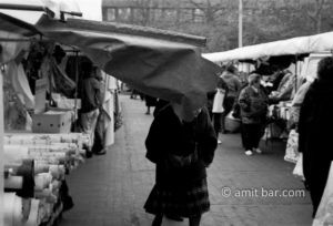 Oh!: A woman crases into a boot-cloth on the market