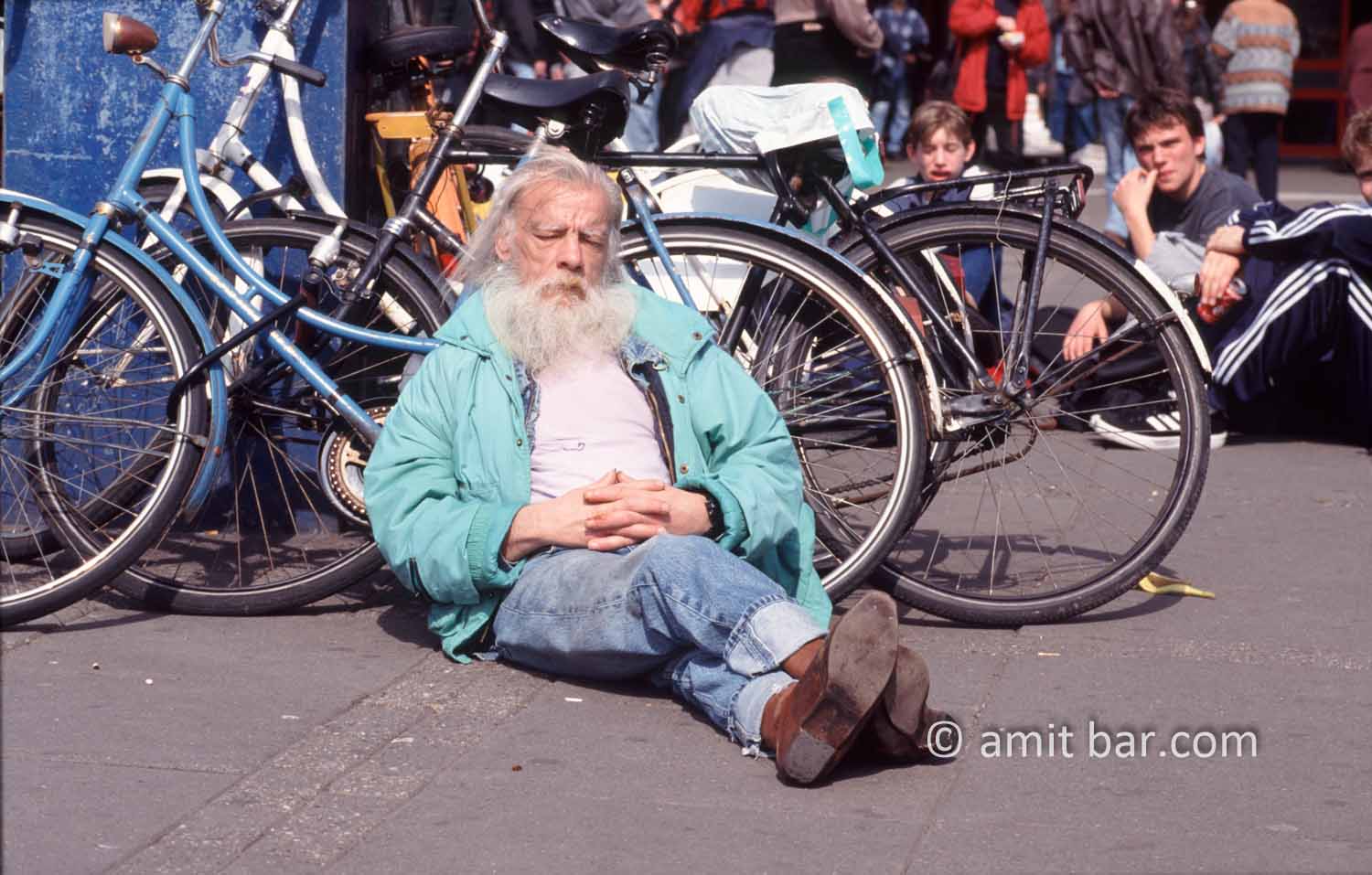 Old man sleeping: Old man is sleeping at the Central Station in Amsterdam