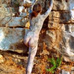 On the rocks II: Body-painted model in the Israeli nature