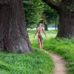 Pastoral Idyll III: A nude model is walking and dancing among the old oak and beech trees beside Ampsen castle, The Netherlands