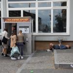 Photoautomat: A runner taking a rest for the benefit of the photo