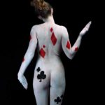 Playing cards II: Body-painted model in card forms of diamonds and spades