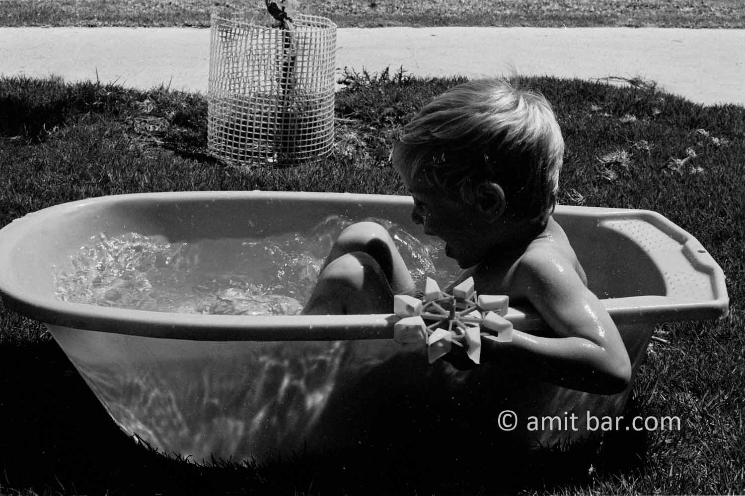 Playing in bath III: A child is plaing in bath