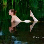 Pool reflection I: Nude model in natural pool