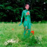 Poppies and Oxeye Daisies II: Body-painted model with flowers in the nature