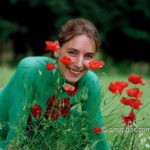 Poppies and Oxeye Daisies III: Portrait of a body-painted model in the nature