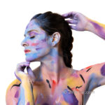 Purple Pris portrait I: Portrait of body-and face-painted Pris Mundar