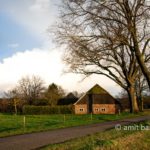 Rain clouds above farmhouse