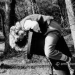 Riding a water pipe: A girl is sitting on unused water-pipe