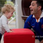 Roaring: A baby and his uncle having fun