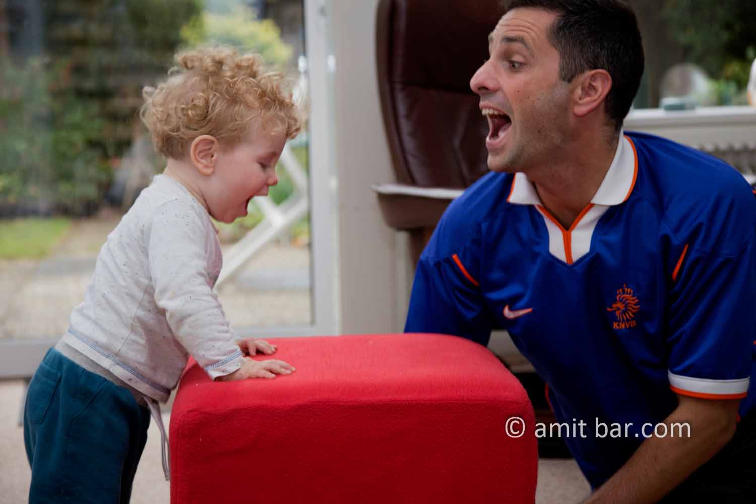 Roaring: A baby and his uncle having fun