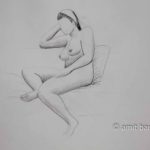 Seated nude model with a band in her hair. Pencil drawing