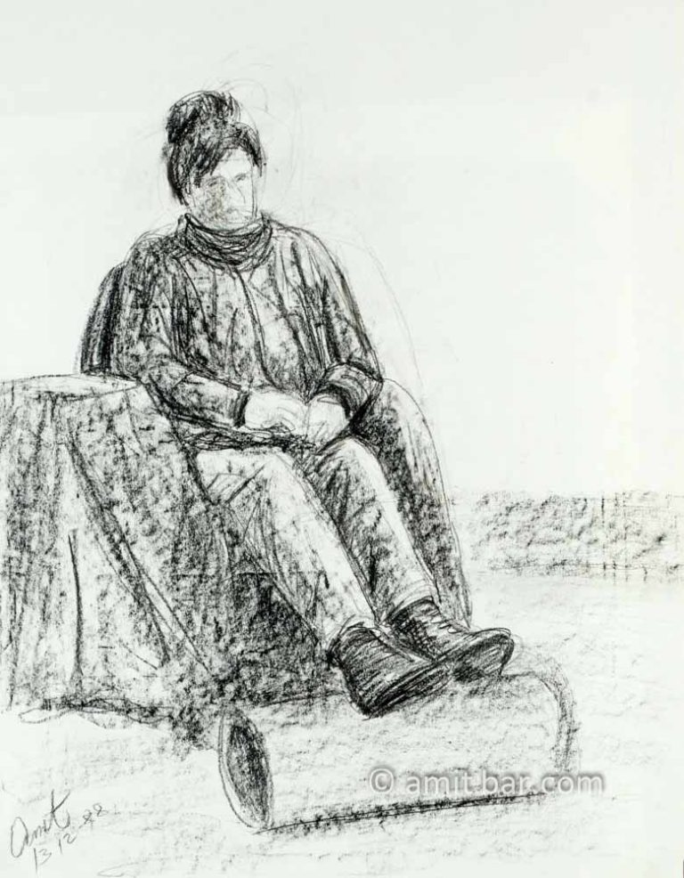 Seated woman with legs on roll