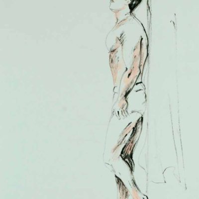 Semi nude man leaning at wall