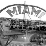 Shaking: A group of fair visitors on shaking-attraction