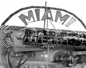 Shaking: A group of fair visitors on shaking-attraction