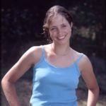Smiling. a smiling girl in blue shirt