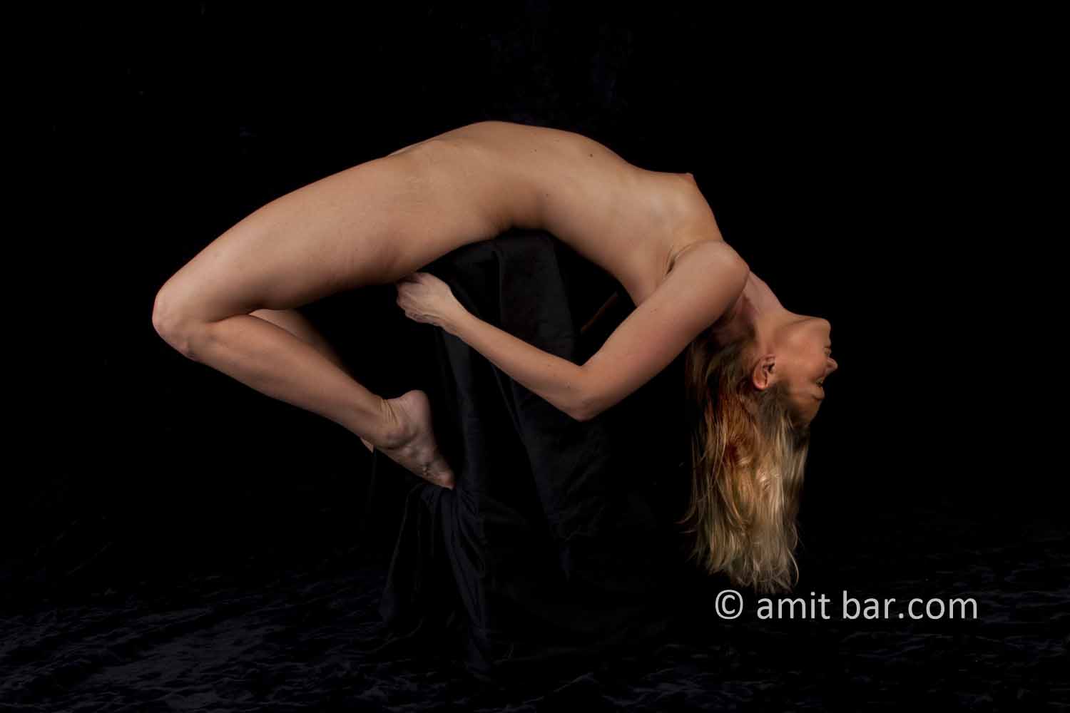 Streched II: Nude model on a high stool