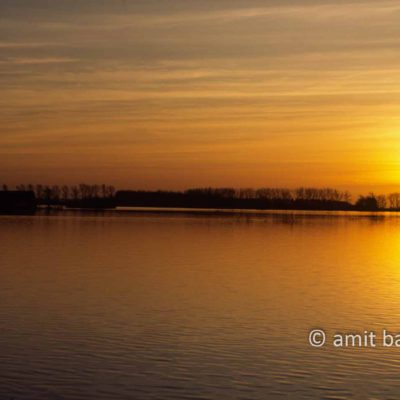 Sunset above flooded landscape