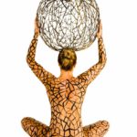The Apple: Body-painted model with iron apple on her head