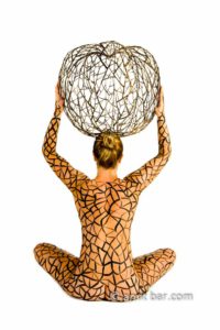 The Apple: Body-painted model with iron apple on her head