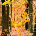 The Cuckoo I: body-painted dancer as a cuckoo is dancing in the forest