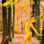 The Cuckoo II: body-painted dancer as a cuckoo is dancing in the forest