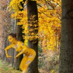 The Cuckoo III: body-painted dancer as a cuckoo is dancing in the forest