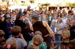 The revenge of the thief: The thief is catching back the policeman who caught him. Street theater in Doetinchem, The Netherlands