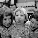 The three of them: Three children are looking to the camera